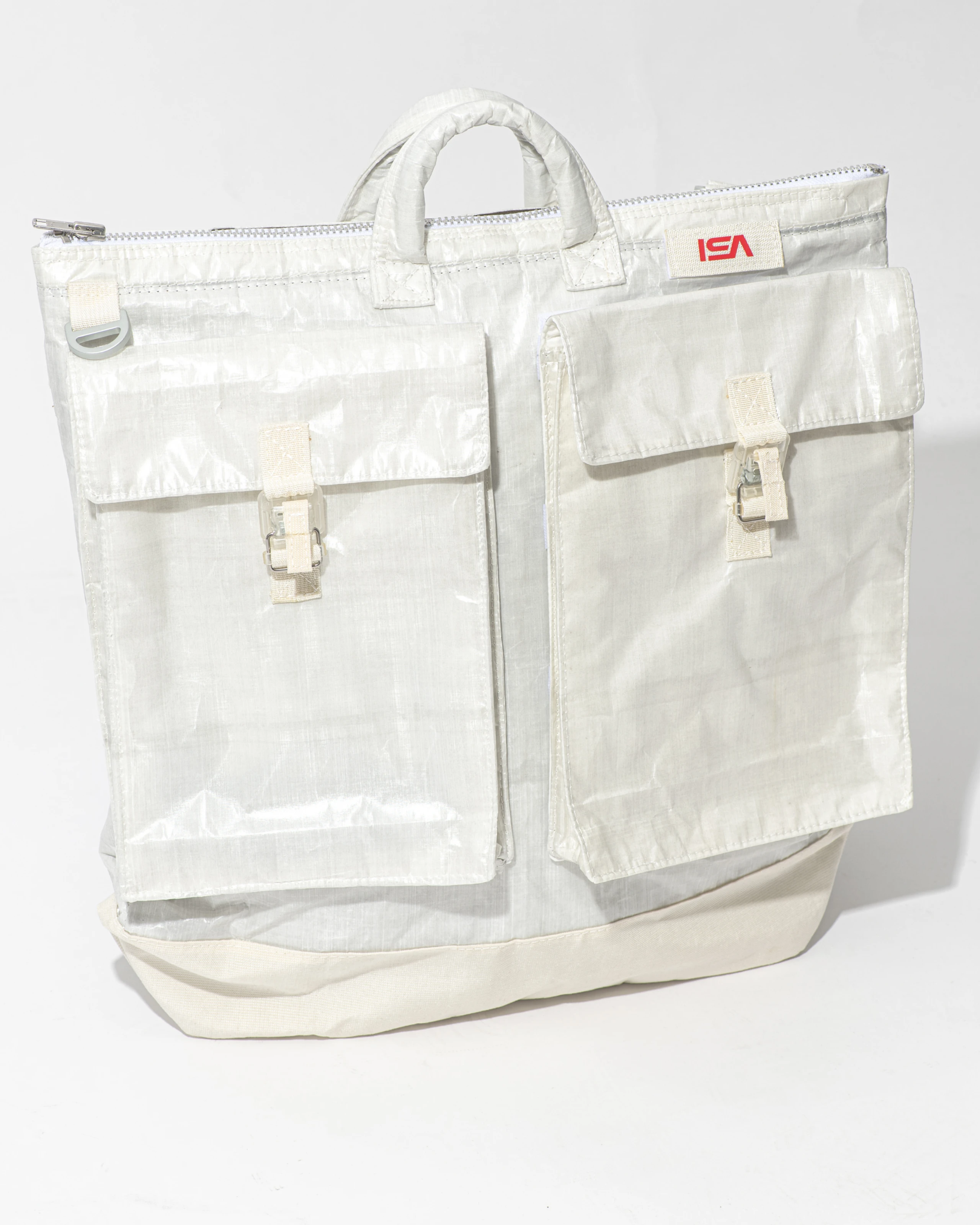 Aerospace helmet bag made of Dyneema fabric and Japanese nylon twill with aluminium trims, front view. 