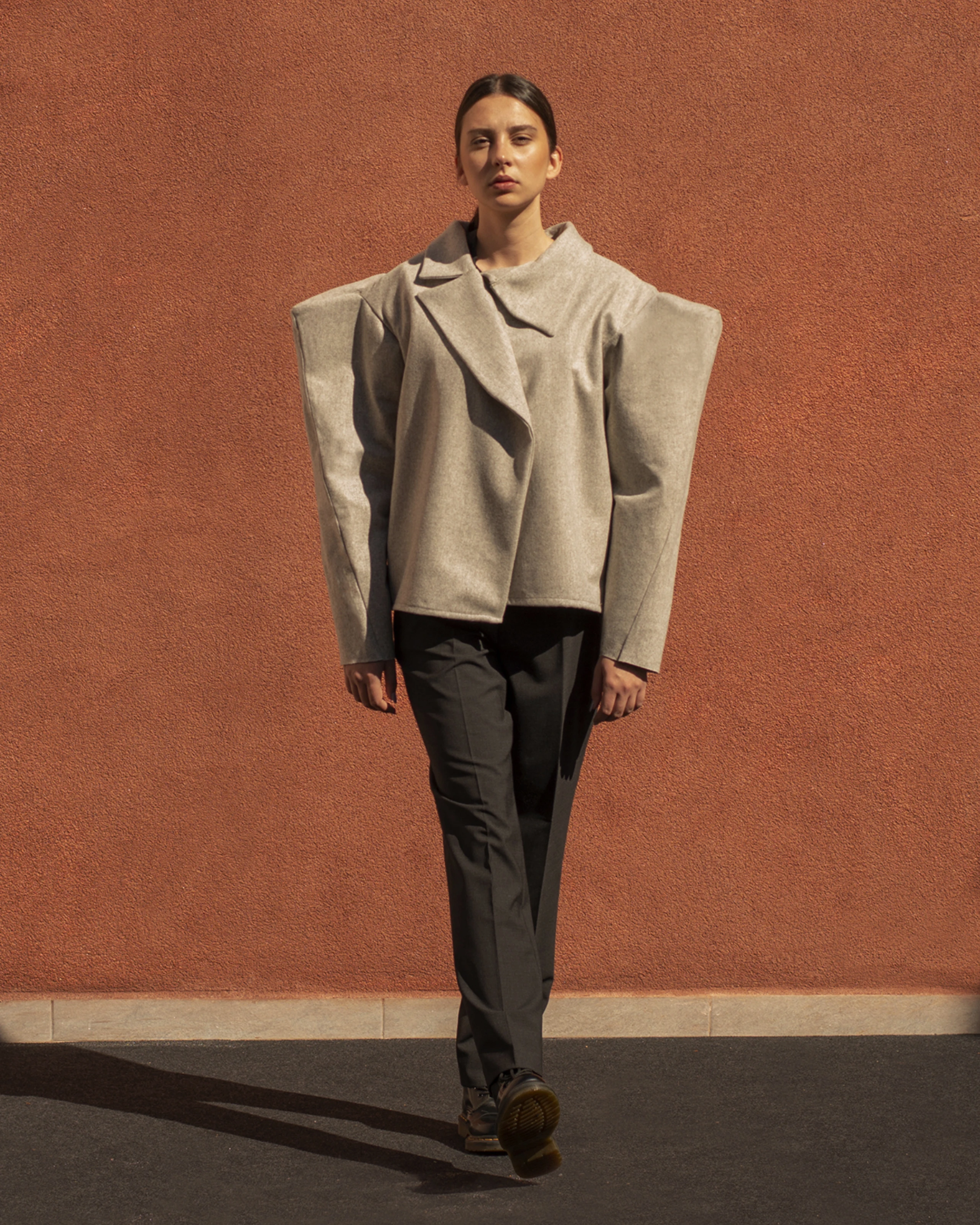 Light gray jacket and dark gray pants from Forme collection. 