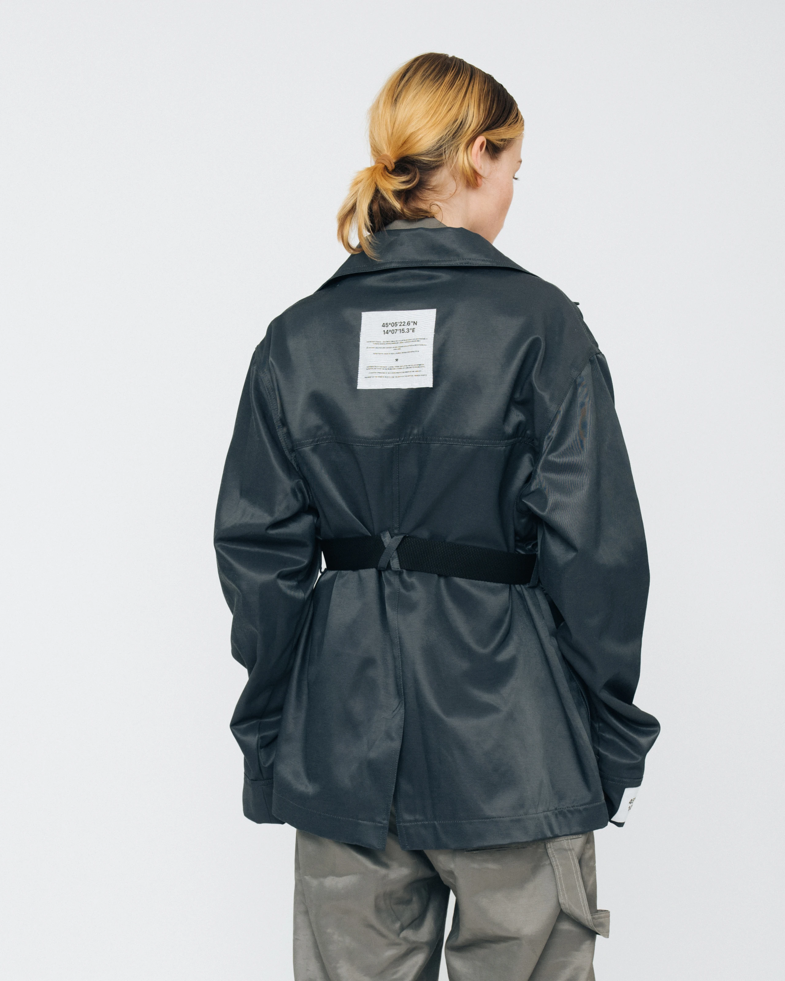 Women's outfit from Kovari collection. Jacket back view. 