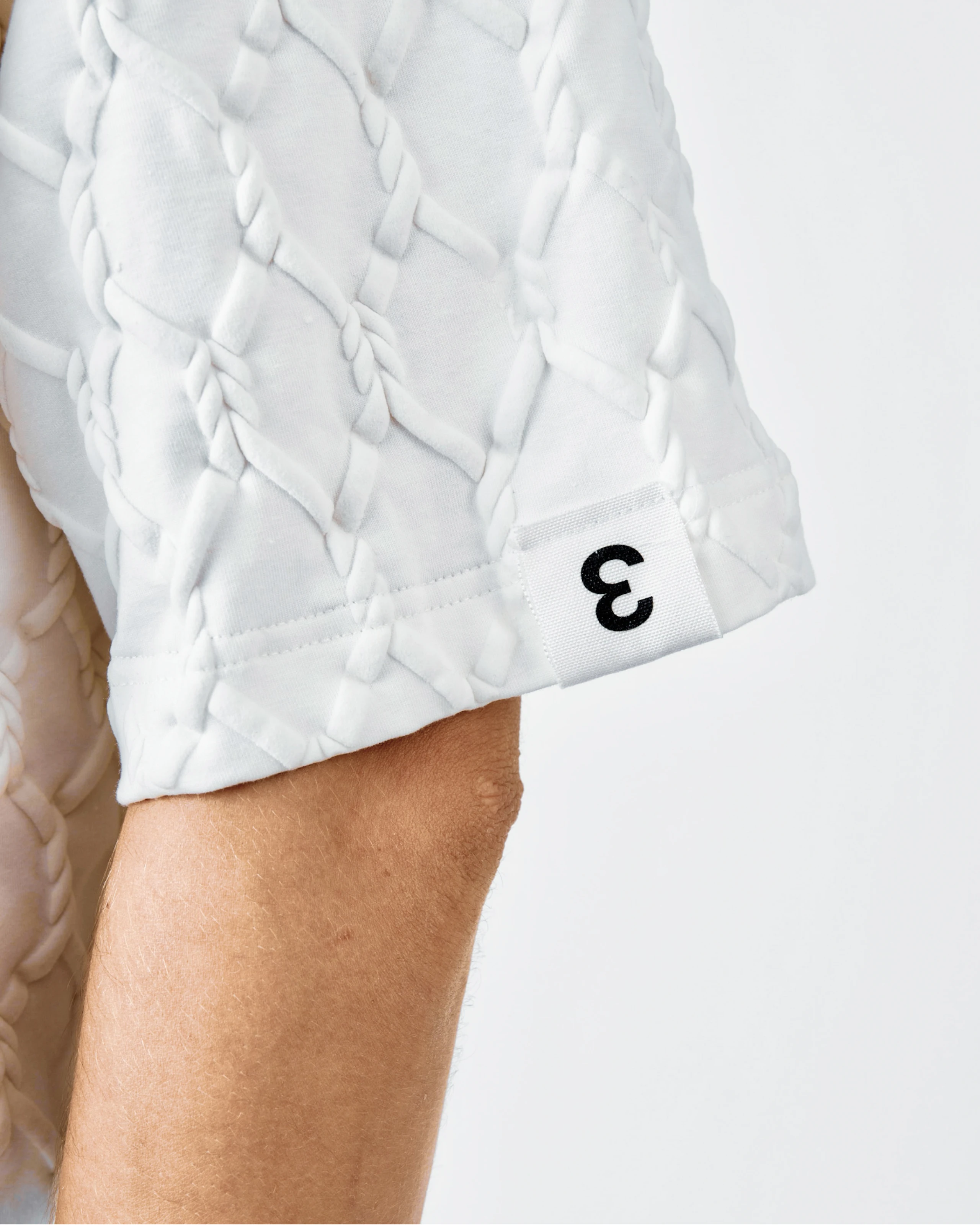 Sleeve t-shirt with puff print and label detail from Kovari collection. 