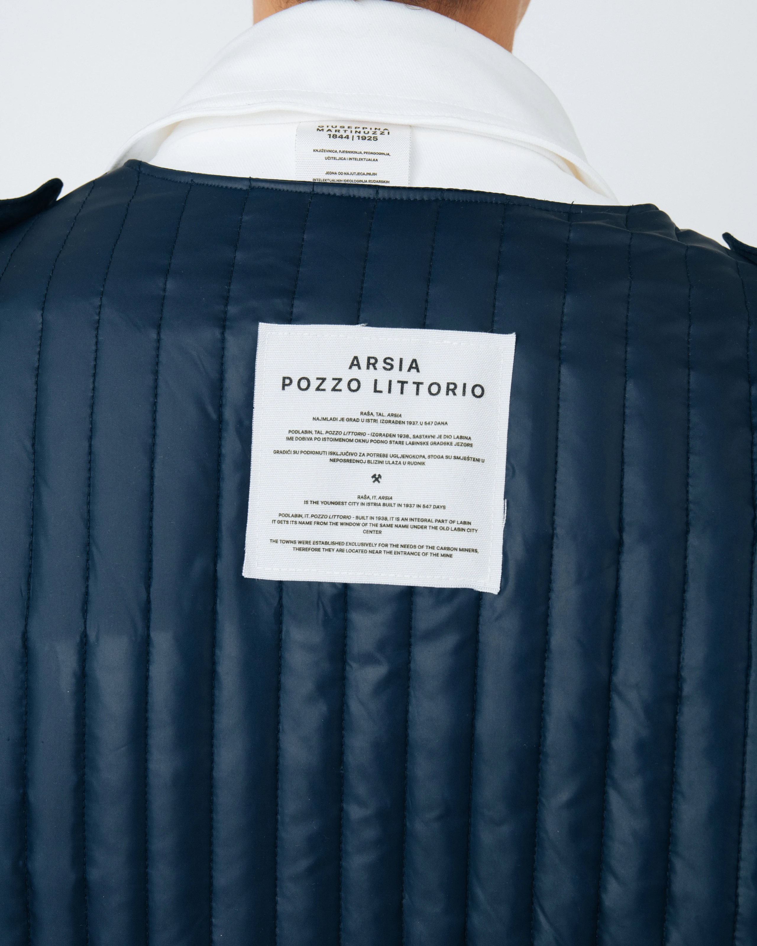 Vest back label details from Kovari collection. 