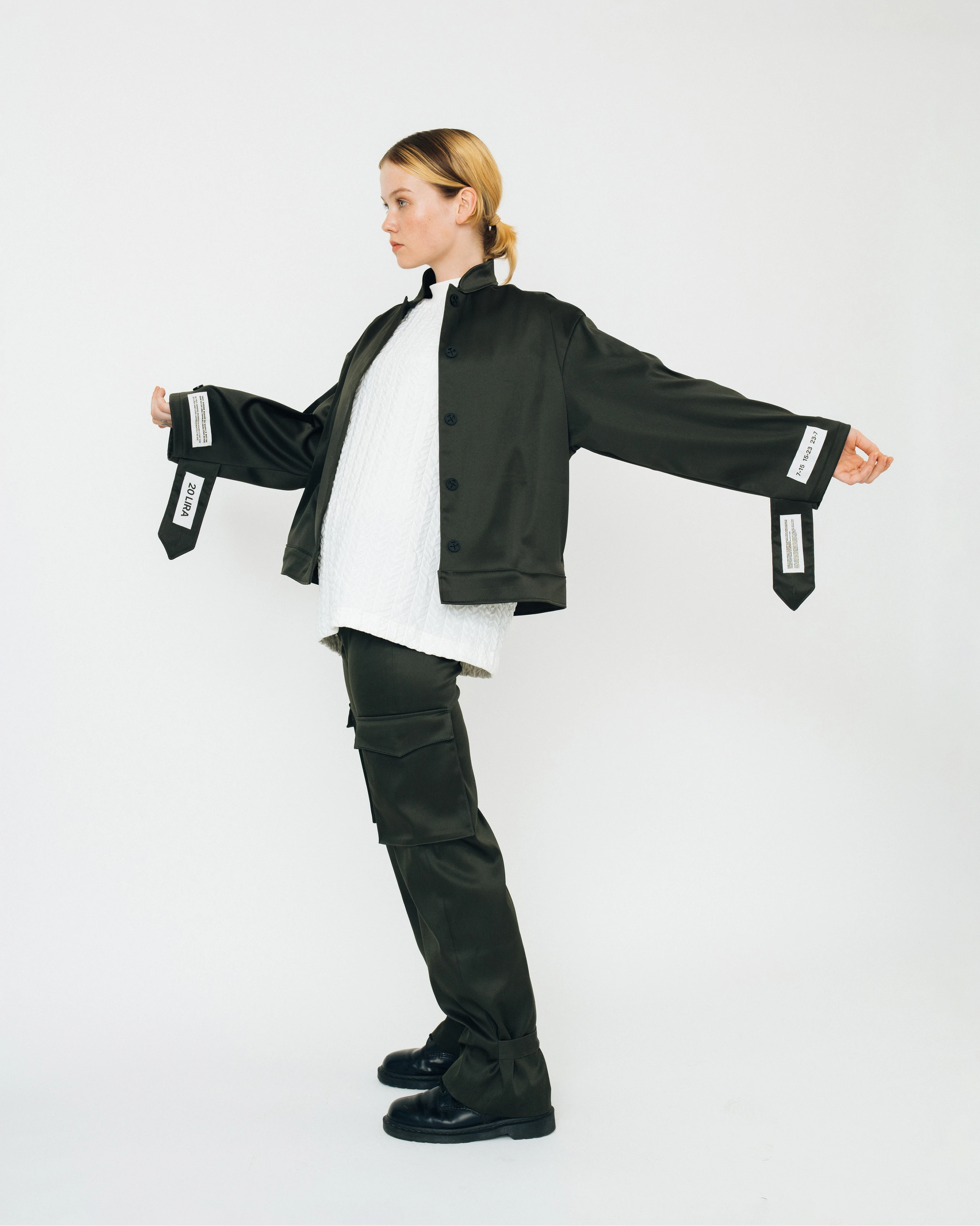 Women's outfit in olive green and white combination from Kovari collection.