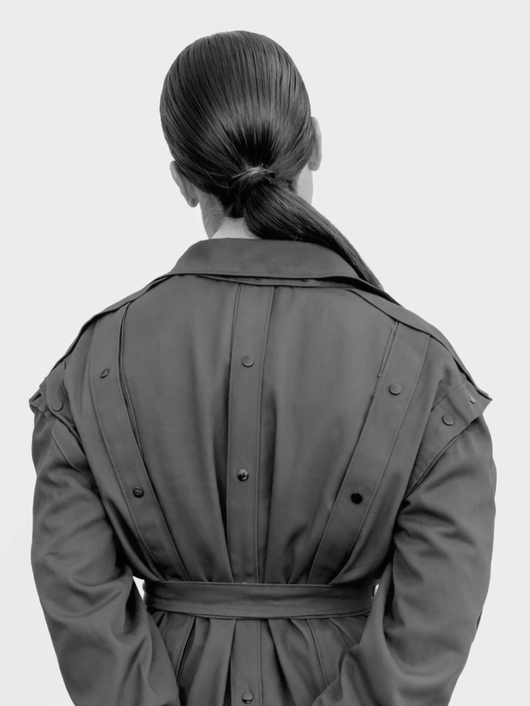 Module collection presenting a modular trench coat in grey twill.