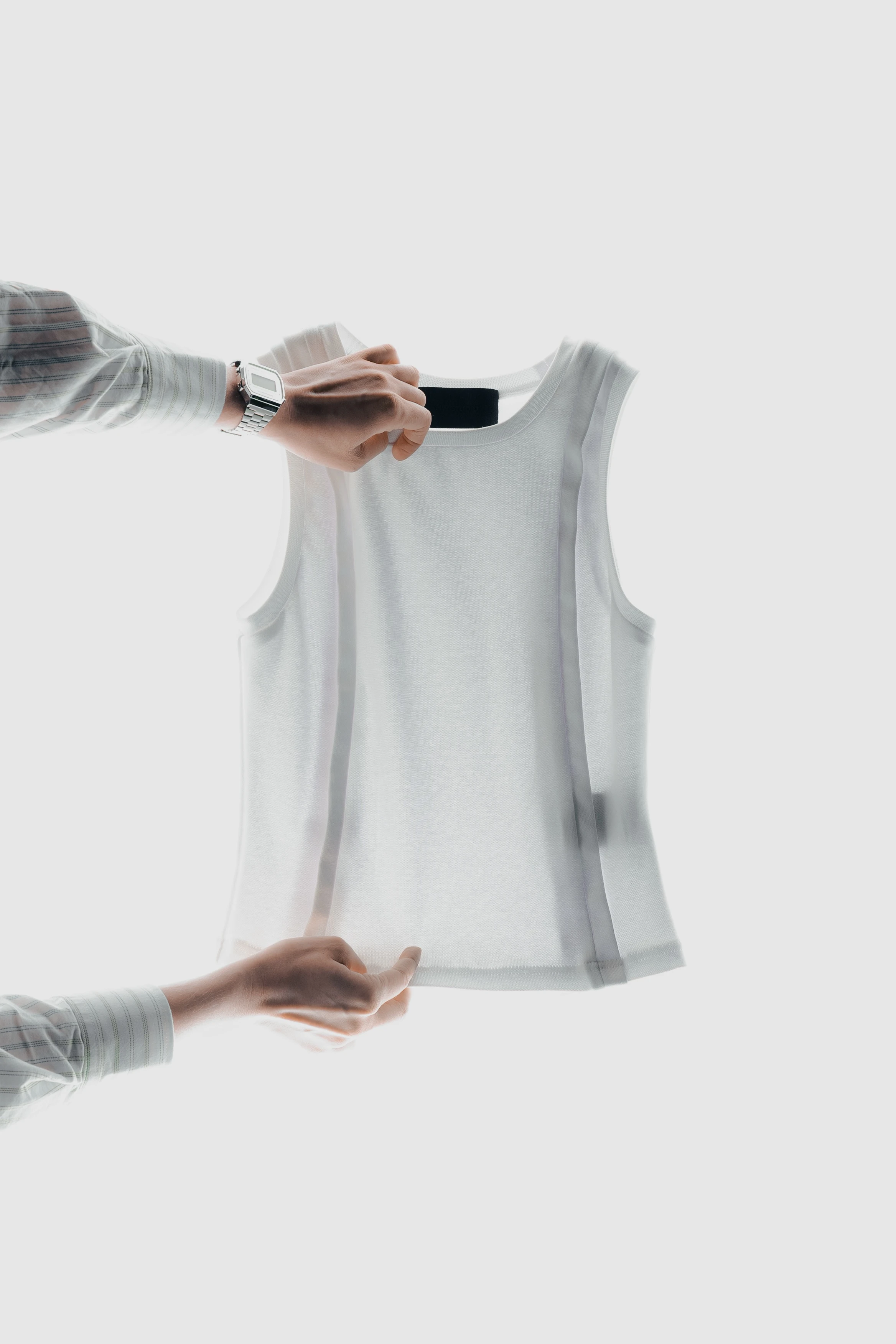 White knitted tank top with tape finishing along the edges.
